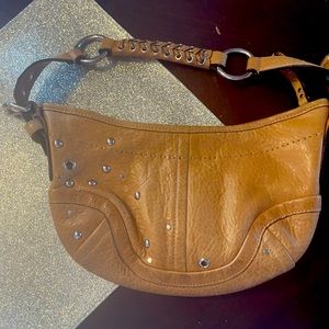 Coach brown leather baguette With braided handle in great condition